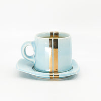Espresso mug and saucer set in sky