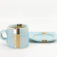 Espresso mug and saucer set in sky