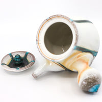 Side-handled teapot, soda fired