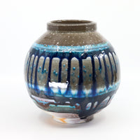 Soda-fired porcelain orb vase