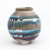 Soda-fired porcelain orb vase