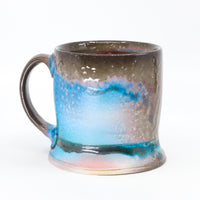 Flat bottom mug sprayed with "positive blue"