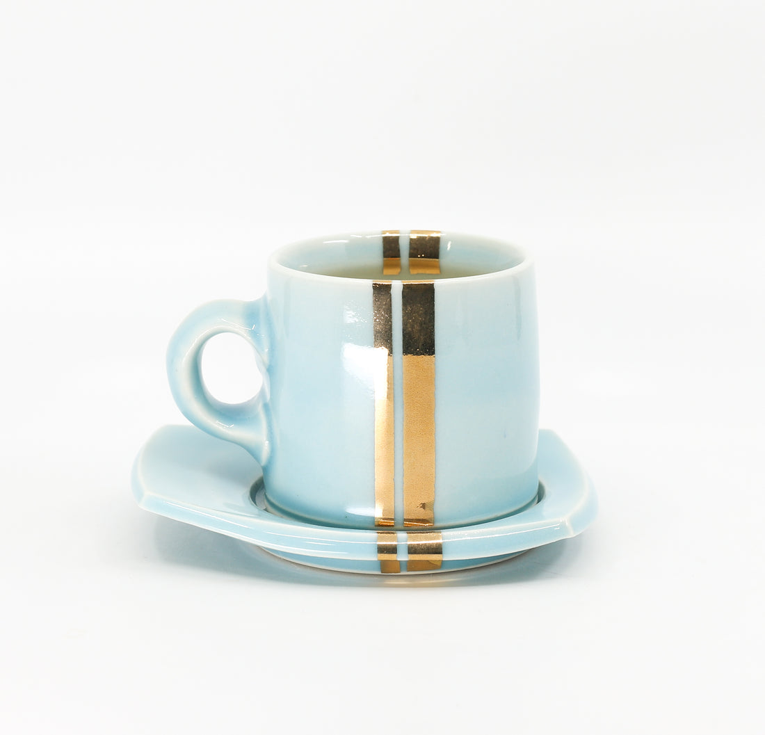 Espresso mug and saucer set in sky