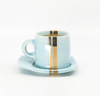 Espresso mug and saucer set in sky