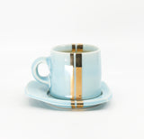 Espresso mug and saucer set in sky