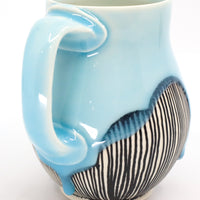 Belly mug in sky
