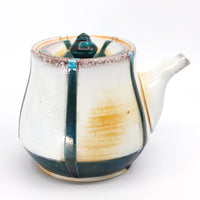 Side-handled teapot, soda fired