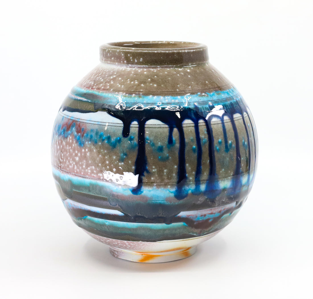 Soda-fired porcelain orb vase