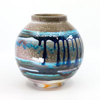 Soda-fired porcelain orb vase