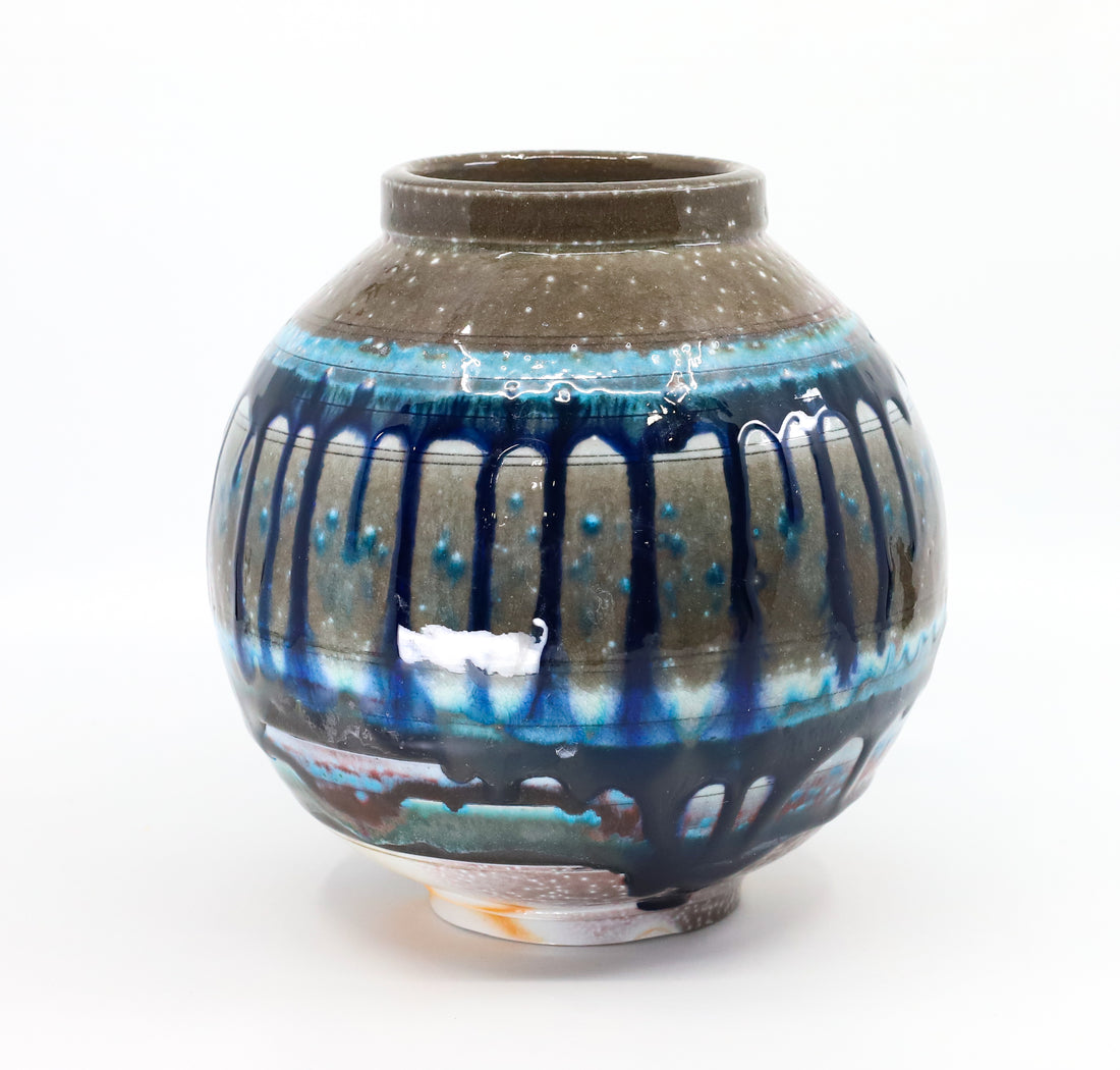Soda-fired porcelain orb vase