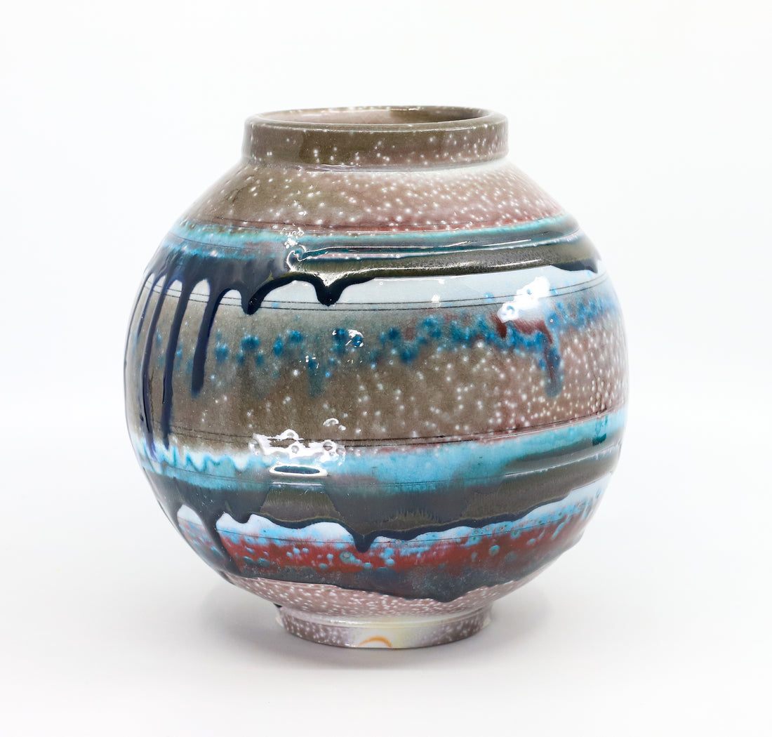 Soda-fired porcelain orb vase