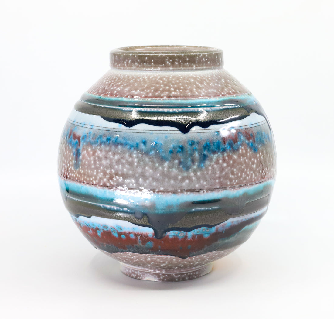 Soda-fired porcelain orb vase