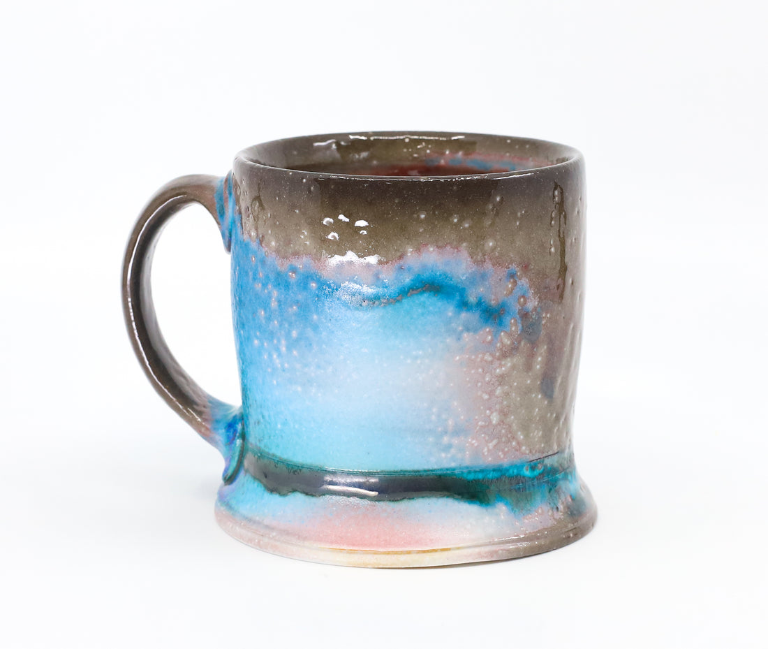 Flat bottom mug sprayed with "positive blue"